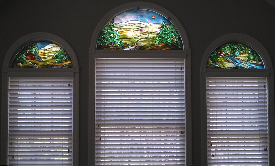 3 stained glass transom windows depicting A Cabin in the Woods, Mount Lafayette, and a Mountian Stream by Chippaway Art Glass