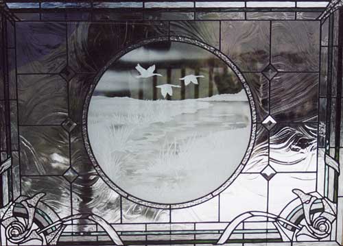 Geese over inter-tidal marsh by Chippaway Art Glass