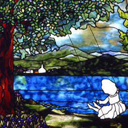 Daddy's Little Girl in Stained Glass - depicts a little girl on a garden swing overlooking a lake, mountains and an idyllic country town